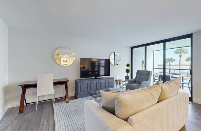 Luxury waterfront condo with shared pool, hot tub, and a tennis court